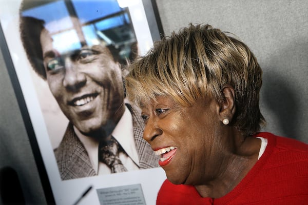 Rubye Lucas speaks next to a portrait of her late husband, Bill Lucas,  during a ceremony at SunTrust Park (now Truist Park) on Feb. 9, 2017.    (Curtis Compton/ccompton@ajc.com)