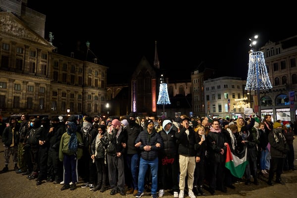 Pro-Palestinian supporters protest in Amsterdam, Netherlands, Wednesday, Nov. 13, 2024, despite a city ban on such gatherings. (AP Photo/Bram Janssen)