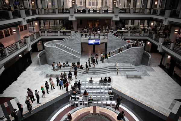 Opponents of the planned public safety training center in DeKalb County descend on Atlanta City Hall during the May 15 full council meeting to sign up for public comment.