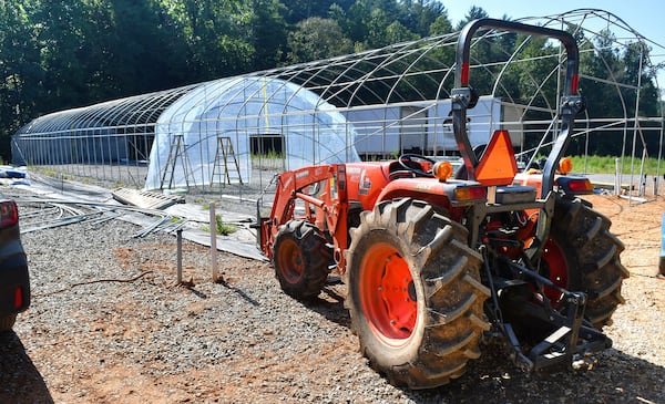 One of the projects underway at Ellijay Mushrooms' farm is the construction of new bigger and taller greenhouses for the mushrooms. As co-owner Howard Berk described, they learned early on that shorter greenhouses held way too much heat inside, which was not conducive to the dark, moist, cool environment that mushrooms require. (Chris Hunt for The Atlanta Journal-Constitution)