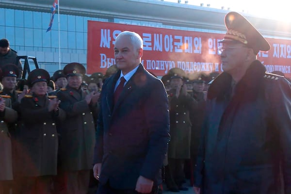 In this photo taken from a video released by Russian Defense Ministry press service, Russian Defense Minister Andrei Belousov, left, is welcomed by North Korean Defense Minister No Kwang Chol upon his arrival at Pyongyang International Airport outside of Pyongyang, North Korea Friday, Nov. 29, 2024. (Russian Defense Press Service via AP)