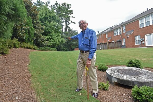 August 29, 2018 Milton - Ike Yancy, HOA president of the Regency at Windward Square, expresses his concern as he stands at a marker in the Regency at Windward Square in Milton on Wednesday, August 29, 2018. Ike Yancy and other residents are opposed to plans to expand SR 9 to four lanes, with a median and multi-use trails. They say it will harm property values and quality of life and take their back yards and landscaped areas. GDOT says it’ll take about 15 feet of land on their side. HYOSUB SHIN / HSHIN@AJC.COM