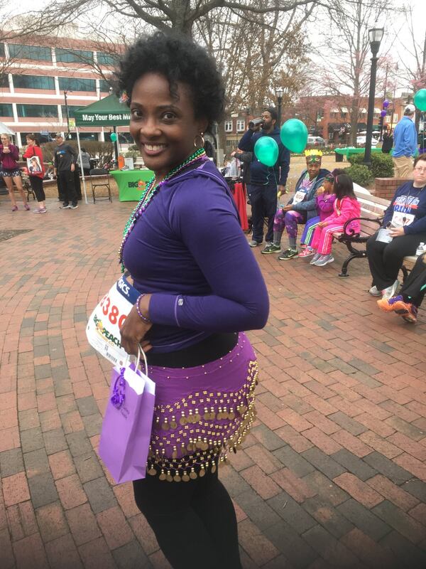 Award-winning runner Crystal Jordan added flair to the Junior League of Cobb-Marietta’s recent Mardi Gras 5K Fun Run and Walk. JENNIFER BRETT / JBRETT@AJC.COM