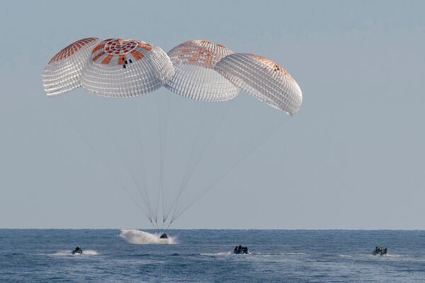 In this image provided by NASA, a SpaceX capsule splashes down in the Gulf of Mexico, Tuesday, March 18, 2025, as it lands off the coast of Florida with NASA astronauts Suni Williams, Butch Wilmore and Nick Hague, and Russian cosmonaut Alexander Gorbunov. (Keegan Barber/NASA via AP)