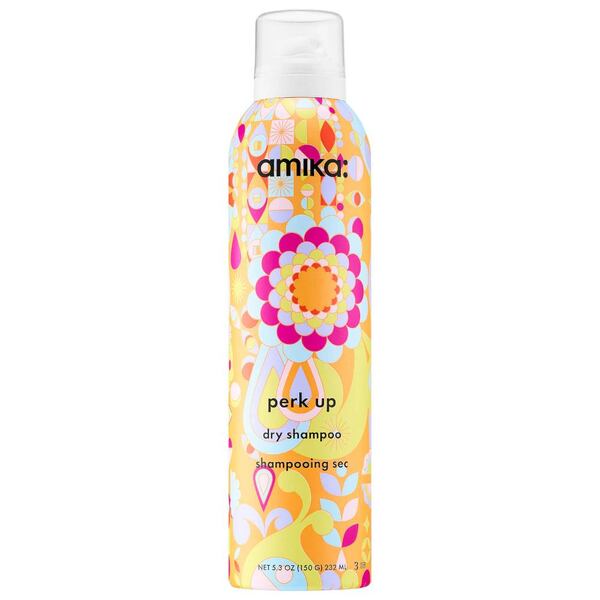 Amika Perk Up talc-free dry shampoo spray boasts a fragrance that combines warm vanilla, spicy sweet clover and fresh citrus.