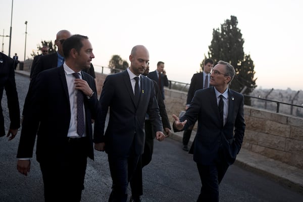 French Foreign Minister Jean-Noël Barrot, center, walks with staff on the Mount of Olives during his visit to Jerusalem, Thursday, Nov. 7, 2024. (AP Photo/Maya Alleruzzo)