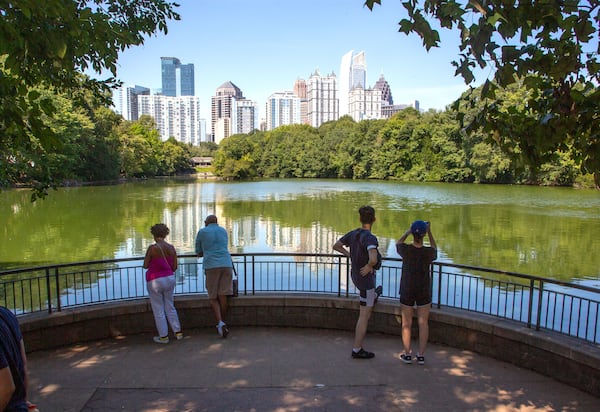 People photograph the Atlanta skyline during the Atlanta Jazz Festival in Piedmont Park on Sunday, September 5, 2021. STEVE SCHAEFER FOR THE ATLANTA JOURNAL-CONSTITUTION