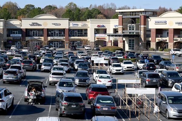 The parking lot at Suwanee's Galleria at Sugarloaf, which is home to a couple dozen Korean businesses, is packed on Thursday, Dec. 5, 2024. (Hyosub Shin/AJC)