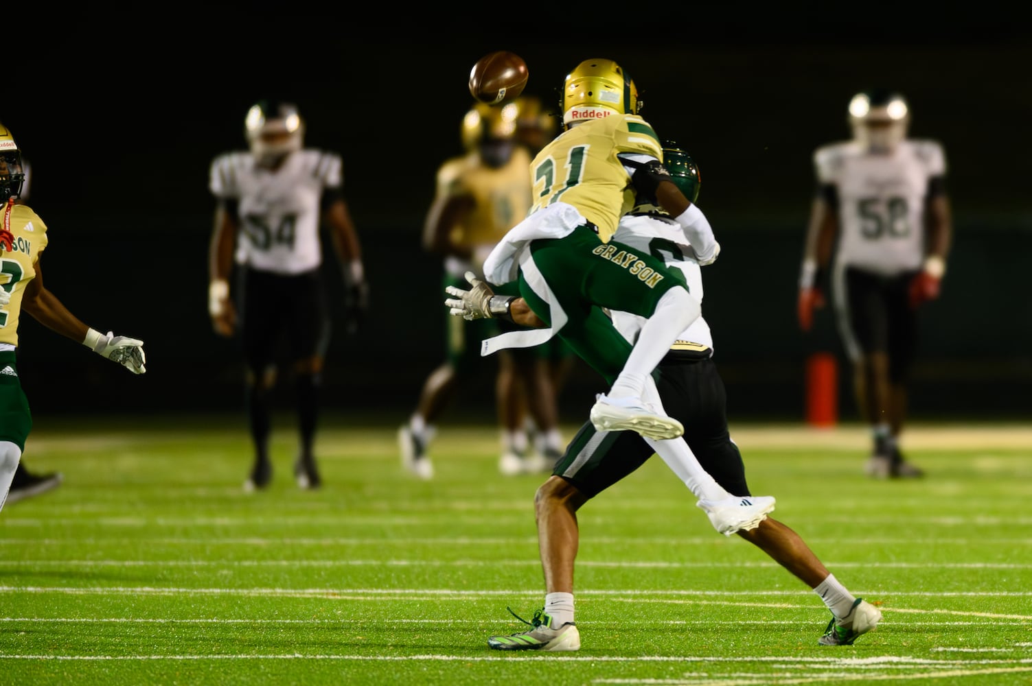 Rilee Drew of Grayson attempts to stop a Collins Hill catch. (Jamie Spaar for the Atlanta Journal Constitution)