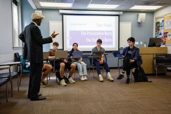 Emory University economics professor Melvin Ayogu talks with first-year students about the economics of money laundering on Wednesday April 24, 2024.
(Miguel Martinez / AJC)