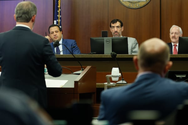 Judicial Qualifications Commission panel Dax Lopez, Judge Robert McBurney and Jack Winter listen to opening remarks from JQC director Chuck Boring on day one Court of Appeals Judge Christian Coomer’s trial on Monday, October 17, 2022. (Natrice Miller/natrice.miller@ajc.com)  


