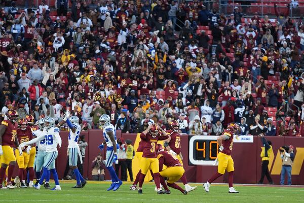 Washington Commanders place kicker Austin Seibert (3) reacts after an unsuccessful point after attempt during the second half of an NFL football game against the Dallas Cowboys, Sunday, Nov. 24, 2024, in Landover, Md. (AP Photo/Stephanie Scarbrough)