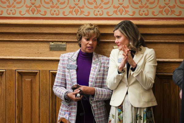 Sen. Sonya Halpern (left), D-Atlanta, speaks with Sen. Elena Parent, D-Atlanta, in the Senate Chambers during legislative day 26 in the state Capitol on Monday, March, 3, 2025, in Atlanta. (Jason Getz/AJC)