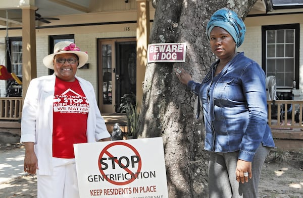 September 12, 2019 - Atlanta - Peoplestown residents Bertha Darden (left) Tanya Washington in front of Washington’s home. For the past five years, Peoplestown residents have been in an ongoing legal battle with Atlanta after the city attempted to take their properties through eminent domain. The city approved a proposal that would allow them to purchase the homes located near a flood zone and convert the land into a reservoir and park. Since then efforts to seize the four remaining properties that sit on a stretch of Atlanta Avenue it southeast Atlanta have stalled. Bob Andres / robert.andres@ajc.com