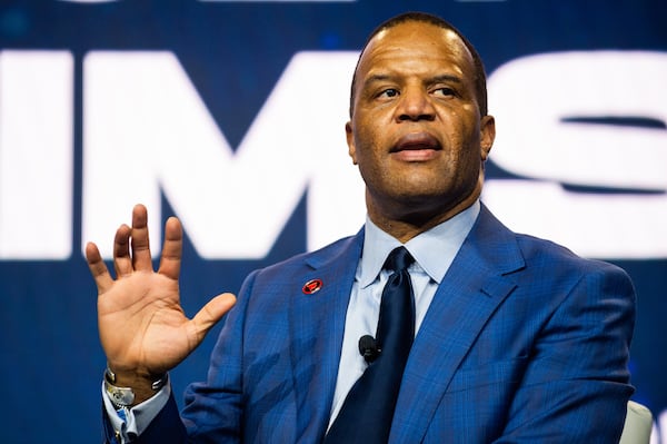 231211 ATLANTA, GA — John Hope Bryant, founder and CEO of Operation HOPE, speaks at the HOPE Global Forums at the Hyatt Regency in downtown Atlanta on Monday, Dec. 11, 2023. 
(Bita Honarvar for The Atlanta Journal-Constitution)