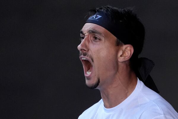 Lorenzo Sonego of Italy reacts during his quarterfinal match against Ben Shelton of the U.S. at the Australian Open tennis championship in Melbourne, Australia, Wednesday, Jan. 22, 2025. (AP Photo/Asanka Brendon Ratnayake)