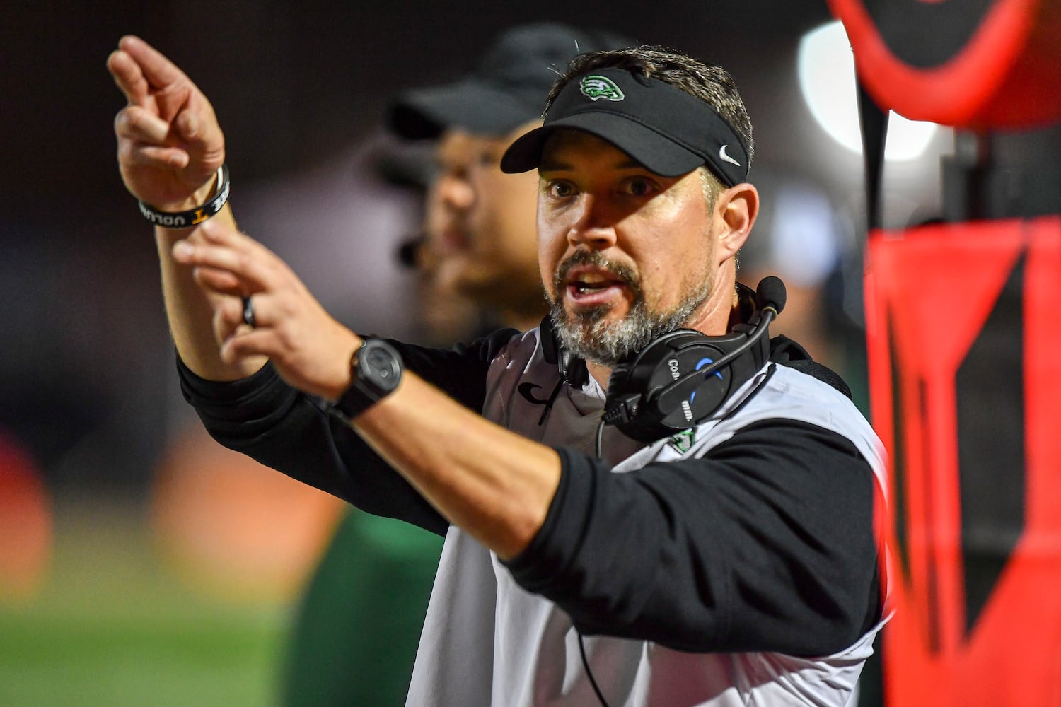 Collins Hill head coach Drew Swick calls a play during the second half of the game Friday, Nov. 10, 2023 at North Cobb High School. (Daniel Varnado/For the AJC)