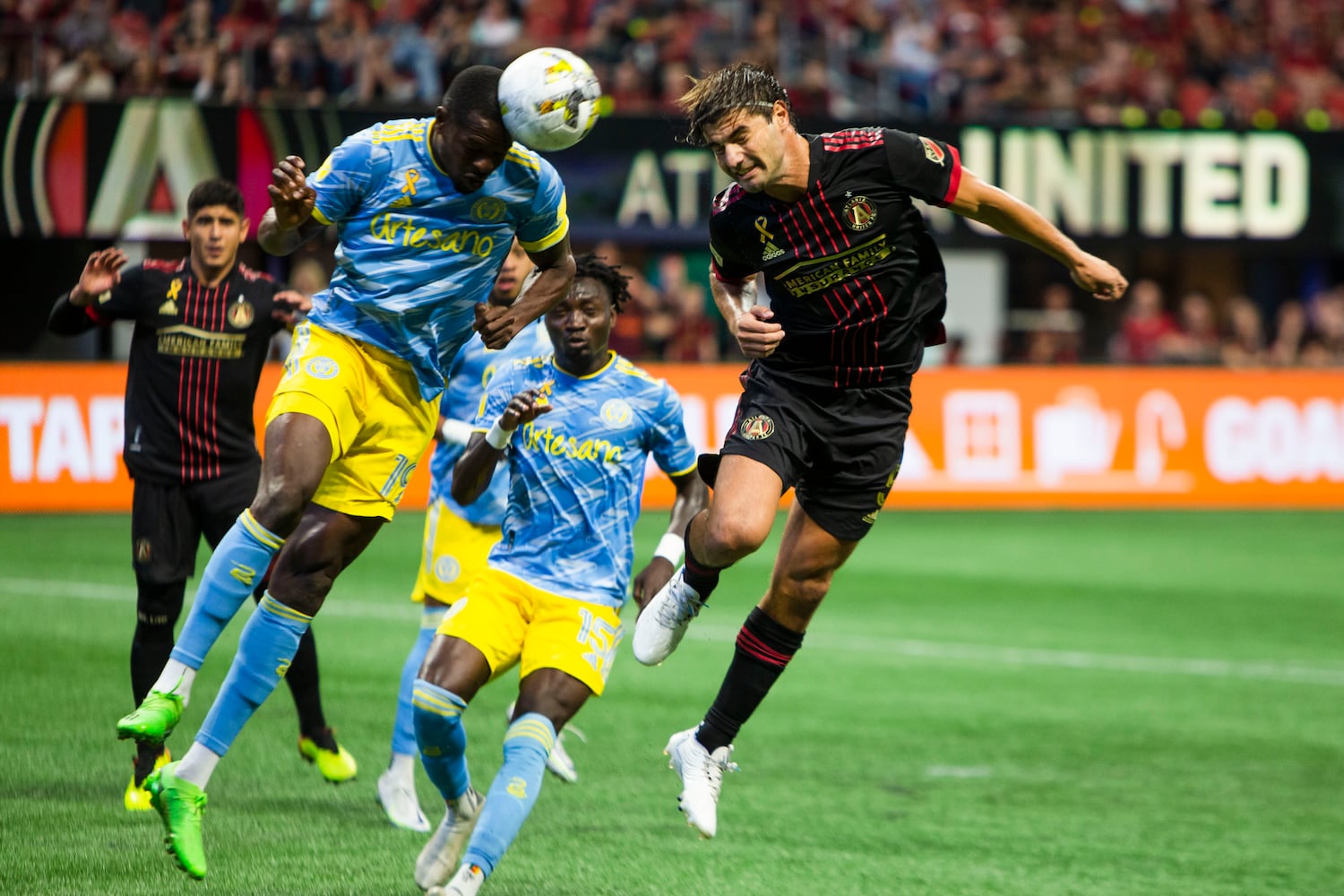 Cory Burke (left), forward for Philadelphia Union, and Santiago Sosa of Atlanta United jump for a header off of the corner kick. CHRISTINA MATACOTTA FOR THE ATLANTA JOURNAL-CONSTITUTION.