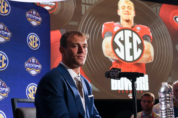 Georgia tight end Brock Bowers listens to a question as an image of Bowers is shown in the background during NCAA college football Southeastern Conference Media Days, Tuesday, July 18, 2023, in Nashville, Tenn. (Jason Getz / Jason.Getz@ajc.com)