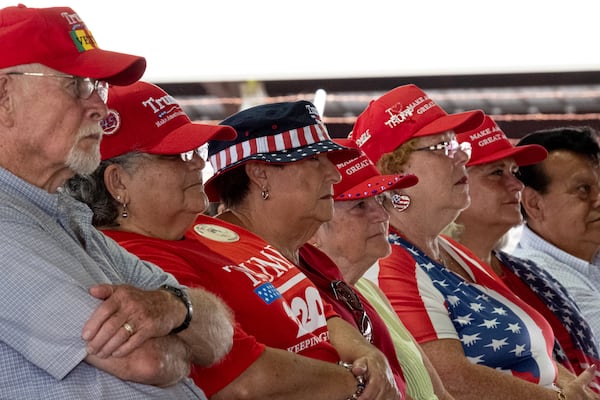 Supporters attend a Republican political rally at the Rome fairgrounds. One supporter at the rally described Marjorie Taylor Greene's appeal this way: “She’s not a typical politician,” Bill Burke said. “She’s not politically correct. I like that about her.” (Ben Gray for the Atlanta Journal-Constitution)