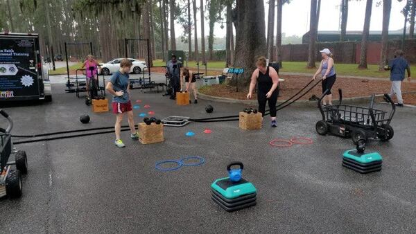 Coach Mike Watson’s clients exercising at a Power In Faith Fitness boot camp. (Photo Courtesy of Mike Watson)