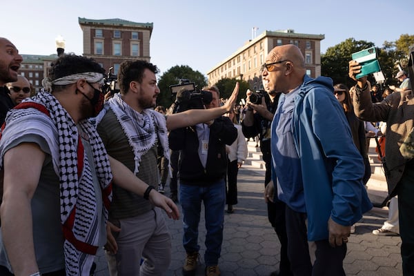 FILE - Pro-Palestinian demonstrator Mahmoud Khalil, second from left, debates with a pro-Israel demonstrator during a protest at Columbia University, Thursday, Oct. 12, 2023, in New York. (AP Photo/Yuki Iwamura, File)