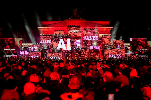 Musicians play on the stage during the concert for freedom for the 35th anniversary of the fall of the Berlin Wall, at the Brandenburg Gate in Berlin, Germany, Saturday, Nov. 9, 2024. (AP Photo/Ebrahim Noroozi)