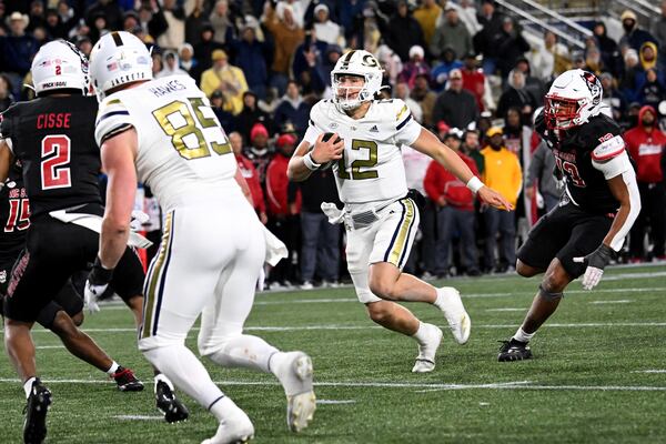 Georgia Tech quarterback Aaron Philo (12) runs for a touchdown during the fourth quarter in an NCAA college football game at Georgia Tech's Bobby Dodd Stadium, Thursday, November 21, 2024, in Atlanta. Georgia Tech won 30-29 over North Carolina State. (Hyosub Shin / AJC)