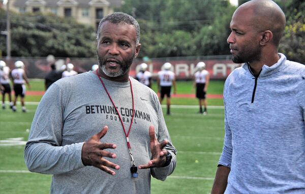 Bethune-Cookman University head coach Terry Sims talks with Clark Atlanta head football coach Tim Bowens. The Bethune-Cookman team played a game in Atlanta on Sunday against Jackson State University but could not return to its campus in Florida due to the threat of Hurricane Dorian. Clark Atlanta has allowed the team to practice on its field and eat in its cafeteria. CONTRIBUTED