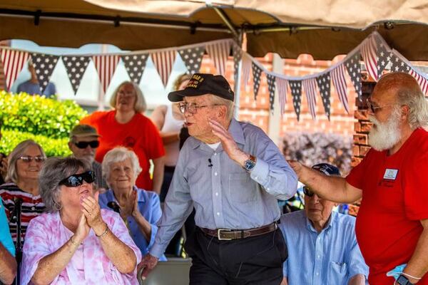 James McCubbin waves to the crowd of attendees at the P51 Mustang demonstration on Wednesday. (Courtesy of Steven Eckhoff)