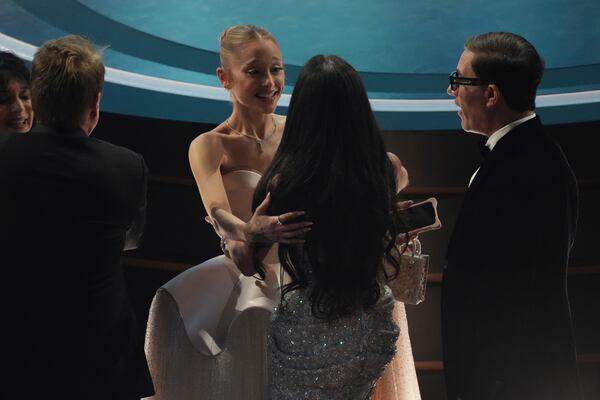 Ariana Grande, left, and Demi Moore in the audience during the Oscars on Sunday, March 2, 2025, at the Dolby Theatre in Los Angeles. (AP Photo/Chris Pizzello)