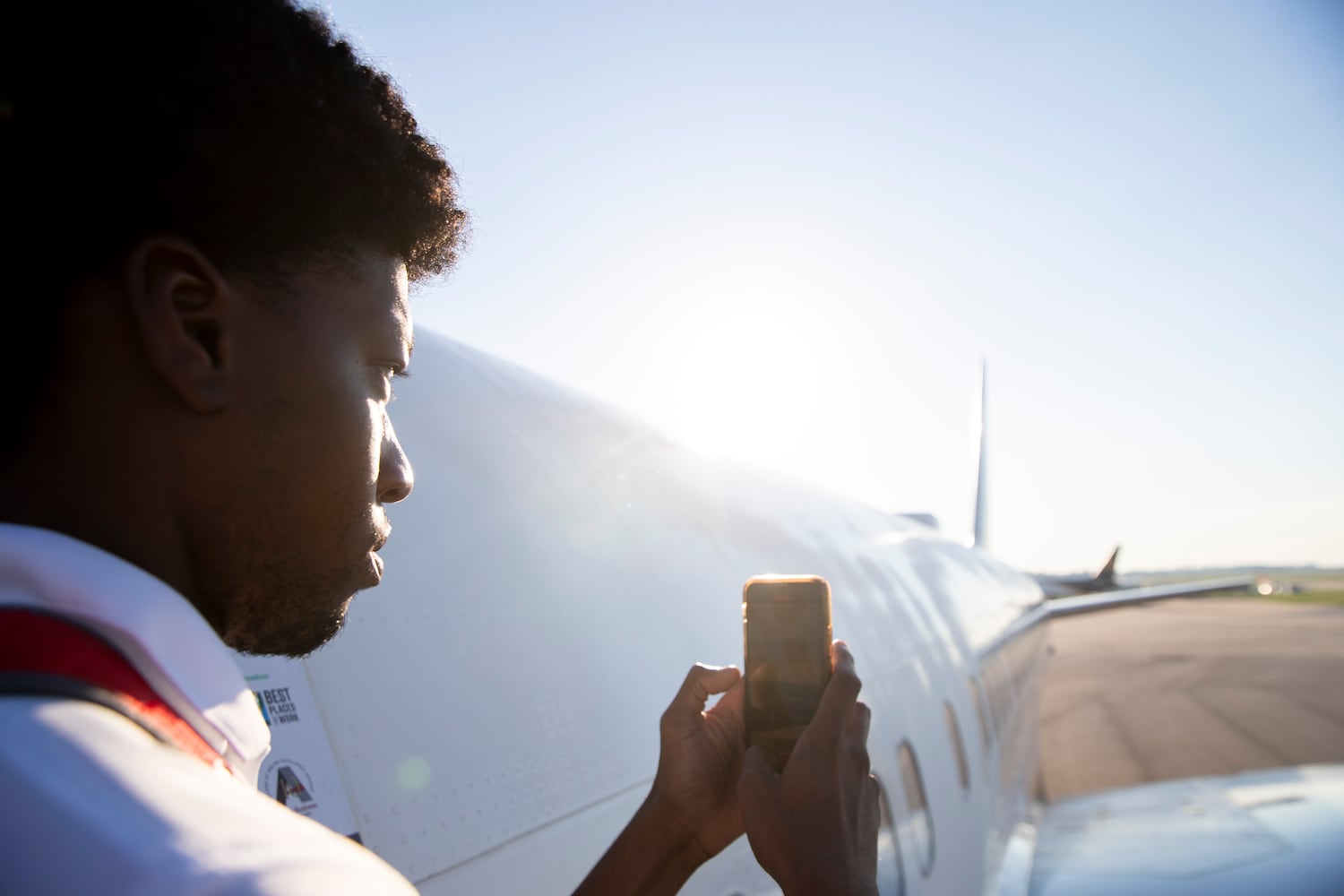 A participant of Delta’s Dream Flight 2022 records the runway before boarding a plane at Hartsfield-Jackson Atlanta International Airport on Friday, July 15, 2022. Around 150 students ranging from 13 to 18 years old will fly from Atlanta to the Duluth Air National Guard Base in Duluth, Minnesota. (Chris Day/Christopher.Day@ajc.com)