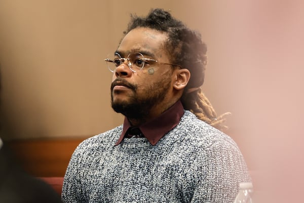 Shannon Stillwell, who was hospitalized last month after being stabbed at The Fulton Jail, returns to court for the ongoing racketeering trial at Fulton County Courthouse on Tuesday, Jan. 2, 2024. (Natrice Miller/ Natrice.miller@ajc.com)