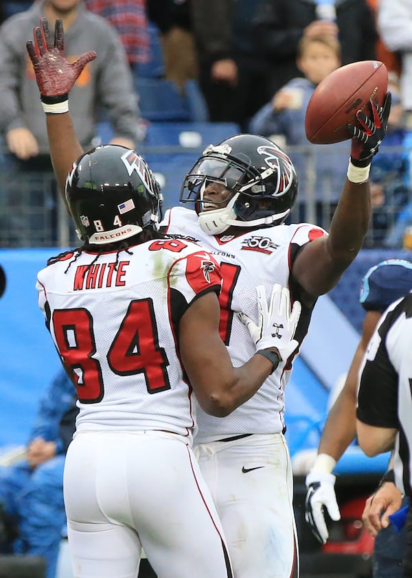 102515 NASHVILLE: -- Falcons wide receiver Julio Jones celebrates what he thought was a touchdown with Roddy White during the fourth quarter against the Titans in a football game on Sunday, Oct. 25, 2015, in Nashville. Officials ruled jones did not get into the endzone on the play. Curtis Compton / ccompton@ajc.com