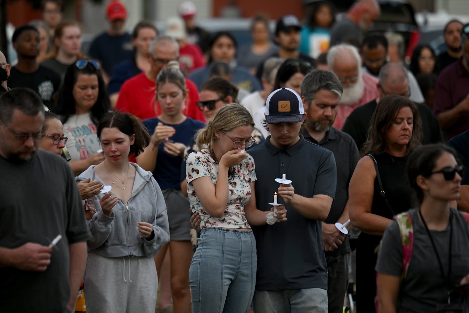 Community members came together during a community candlelight vigil at Jug Tavern Park in Winder on Wednesday, September 4, 2024. (Hyosub Shin / AJC)