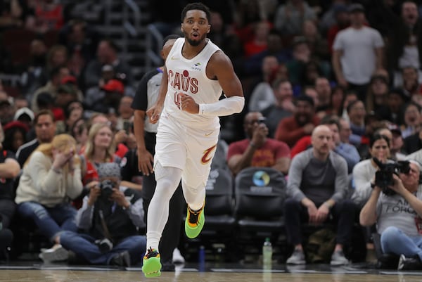 Cleveland Cavaliers guard Donovan Mitchell reacts after making a spinning layup during an NBA basketball game against the Chicago Bulls, Monday, Nov. 11, 2024, in Chicago. (AP Photo/Melissa Tamez)