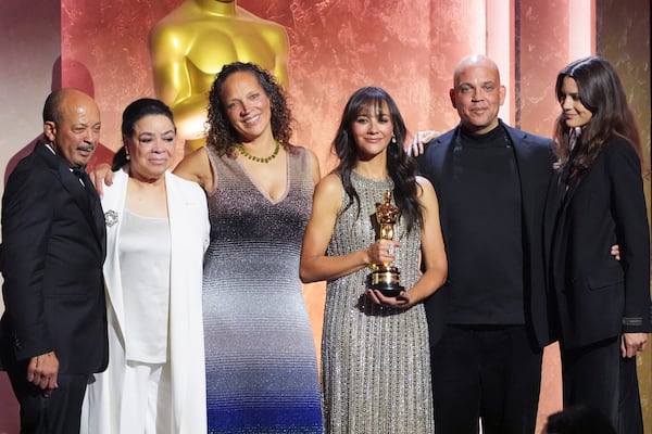 Richard A. Jones, from left, Leslie Jones, Martina Jones, Rashida Jones, Quincy Jones III, and Kenya Kinski-Jones pose with the Honorary Award for Quincy Jones during the 15th Governors Awards on Sunday, Nov. 17, 2024, at The Ray Dolby Ballroom in Los Angeles. (AP Photo/Chris Pizzello)