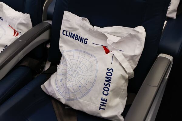 Views of swag bags for travelers on the eclipse flight from Dallas Fort Worth International Airport to Detroit Metro Airport on Monday, April 8, 2024. (Natrice Miller/ AJC)