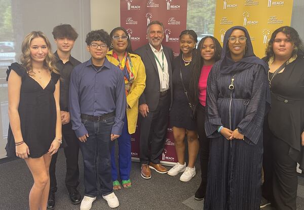 Olivia Connolly (from left), William Edgar, Raul Hernandez-Juarez, Londyn Rosemond, Fulton Superintendent Mike Looney, Alaya Wright, Farrah Brown, Abjen Bouraleh, and Eloiza Sierra. (Courtesy of Fulton County Schools)