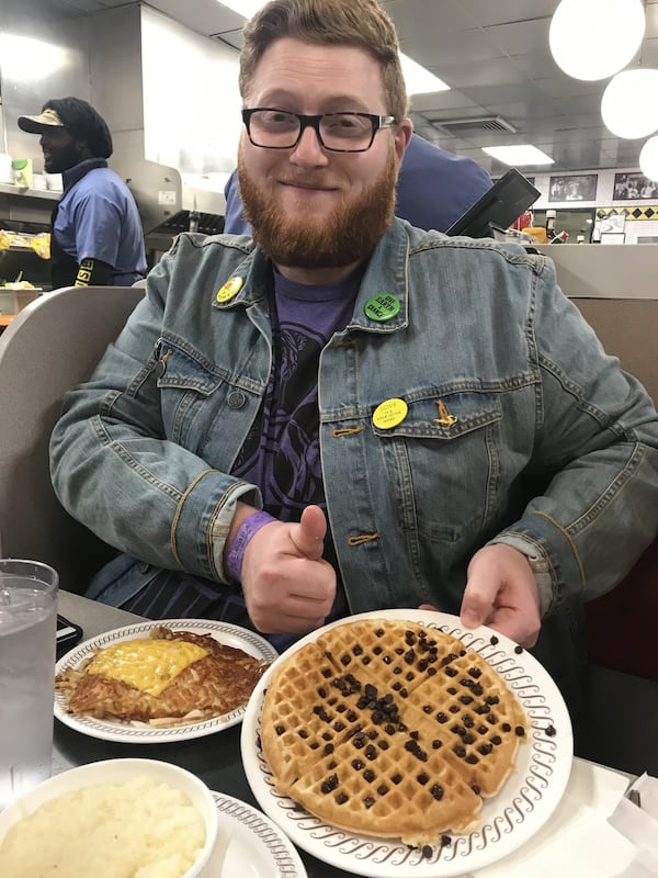 AJC reporter Ben Brasch holds his order of waffles with chocolate chips the night he accompanied AJC dining editor Ligaya Figueras on her first visit to Waffle House. “I hadn’t realized that Ben had ordered his waffle with chocolate chips,” Figueras writes. “I didn’t even realize you could do that here. I loved these people for giving us chocolate chips at 11:15 p.m. on a Saturday night. I felt a surge of warm fuzzies and wanted to give them a hug. I swear I wasn’t drunk.” LIGAYA FIGUERAS / LFIGUERAS@AJC.COM