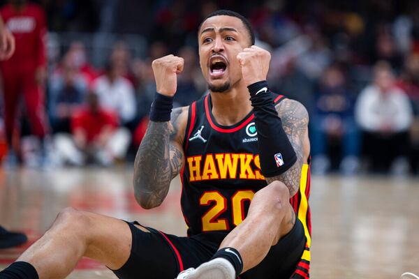 Atlanta Hawks forward John Collins (20) yells during the second half of an NBA basketball game against the Miami Heat, Friday, Jan. 21, 2022, in Atlanta. (AP Photo/Hakim Wright Sr.)