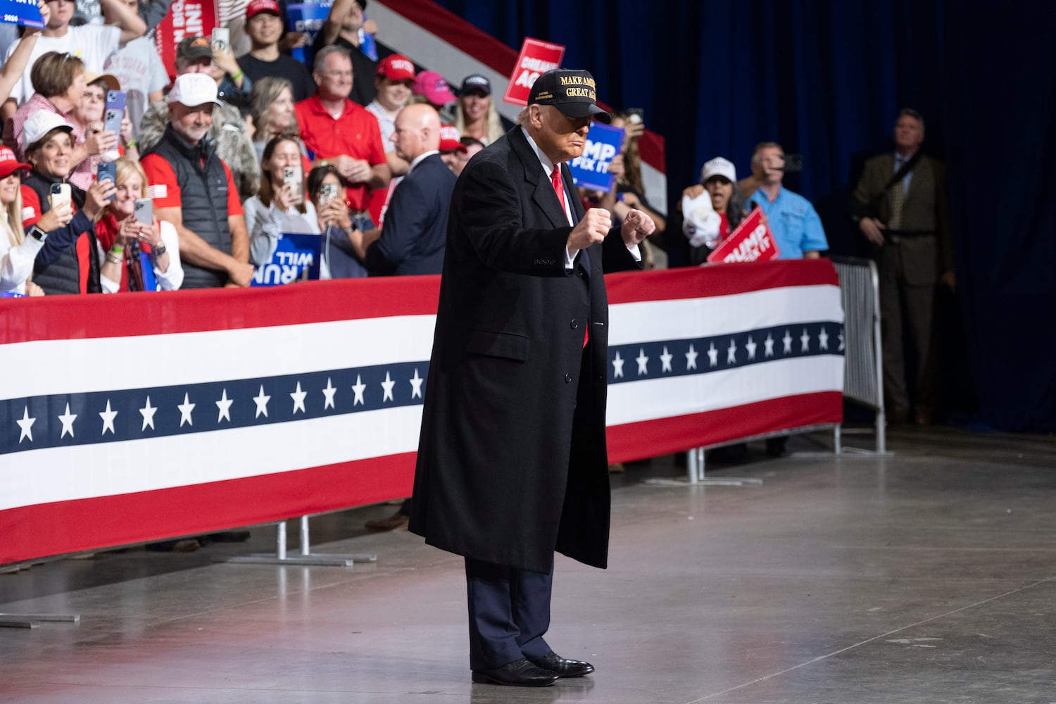 Former President Donald Trump dances after giving remarks at a rally in Macon on Sunday, Nov. 3, 2024.   Ben Gray for the Atlanta Journal-Constitution