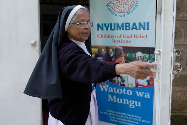 Sister Tresa Pallakudy closes the door at the Nyumbani Children's Home orphanage which is heavily reliant on foreign donations in Nairobi, Kenya Thursday, Oct. 6, 2025. (AP Photo/Brian Inganga)