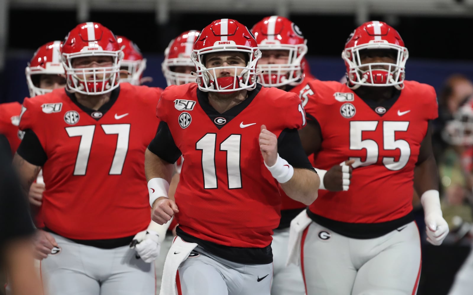 12/7/19 - Atlanta -  Georgia Bulldogs quarterback Jake Fromm (11) leads his team onto the field for warmups during the Georgia vs. LSU SEC Football Championship game at Mercedes-Benz Stadium in Atlanta.  Alyssa Pointer / alyssa.pointer@ajc.com