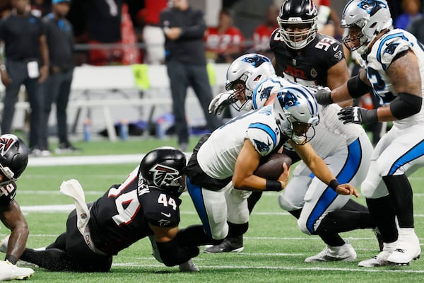 Atlanta Falcons linebacker Troy Andersen (44) sacked Panthers quarterback Bryce Young during the second half on Sunday, Sept. 10, 2023, at Mercedes-Benz Stadium in Atlanta.  Miguel Martinz/miguel.martinezjimenez@ajc.com