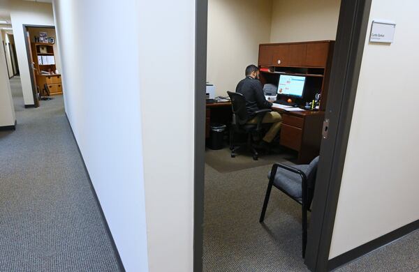 The Georgia Department of Public Health has kept details about its expanded contact tracing program tightly held, but Commissioner Kathleen Toomey said Thursday that the department plans to hire at least 600 additional staff in the weeks ahead and engage upwards of 200 students. One of the epidemiologists working on the program, Curtis Sarkar, is seen here in his office in Lawrenceville. HYOSUB SHIN / HYOSUB.SHIN@AJC.COM