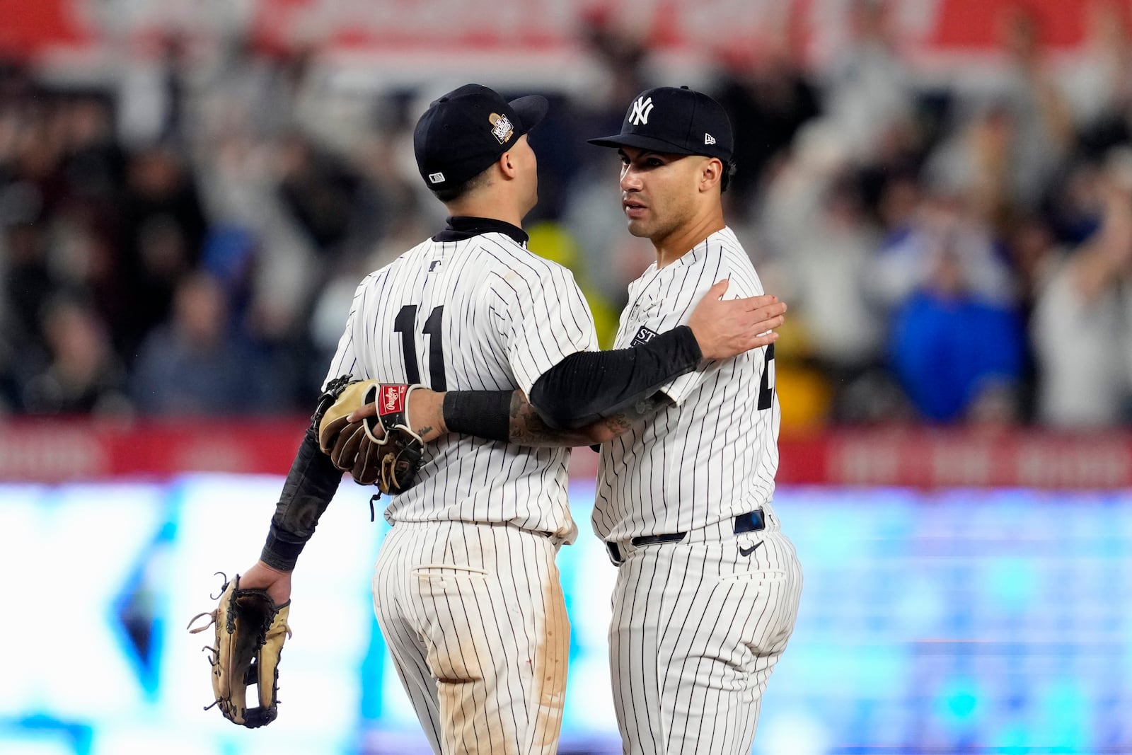 New York Yankees' Anthony Volpe (11) and Gleyber Torres celebrate after Game 4 of the baseball World Series against the Los Angeles Dodgers, Tuesday, Oct. 29, 2024, in New York. The Yankees won 11-4. (AP Photo/Godofredo A. Vásquez)