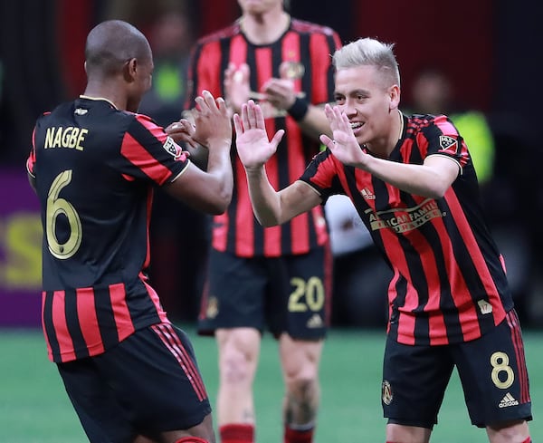 March 17, 2019 Atlanta: Atlanta United midfielder Ezequiel Barco (right) gets five from Darlington Nagbe after heading the ball into the net past Philadelphia Union defender Haris Medunjanin to tie it up 1-1 during the second half in a MLS soccer match that ended in a 1-1 draw on Sunday, March 17, 2019, in Atlanta.   Curtis Compton/ccompton@ajc.com