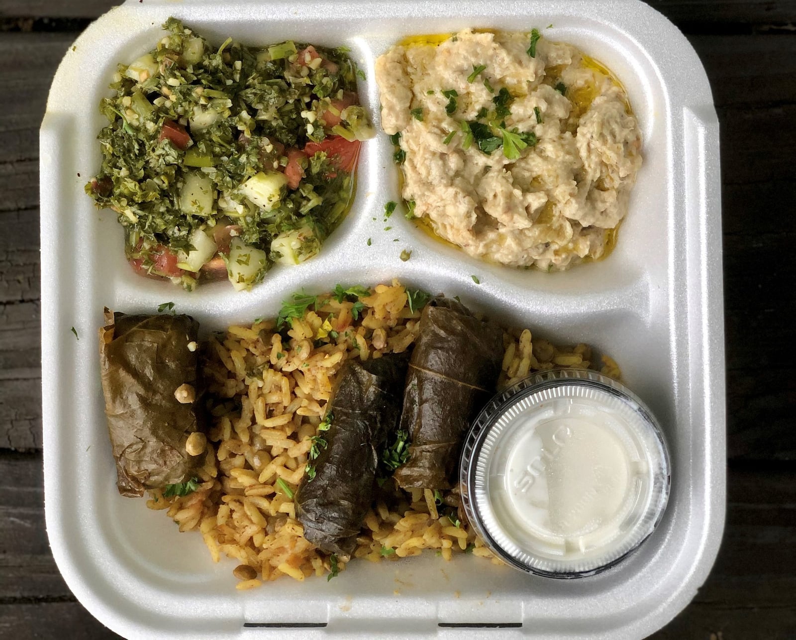 Olive Bistro’s Mediterranean platter includes tabbouleh, baba ghanoush, dolmas, lentils and rice, and tzatziki sauce. CONTRIBUTED BY WENDELL BROCK