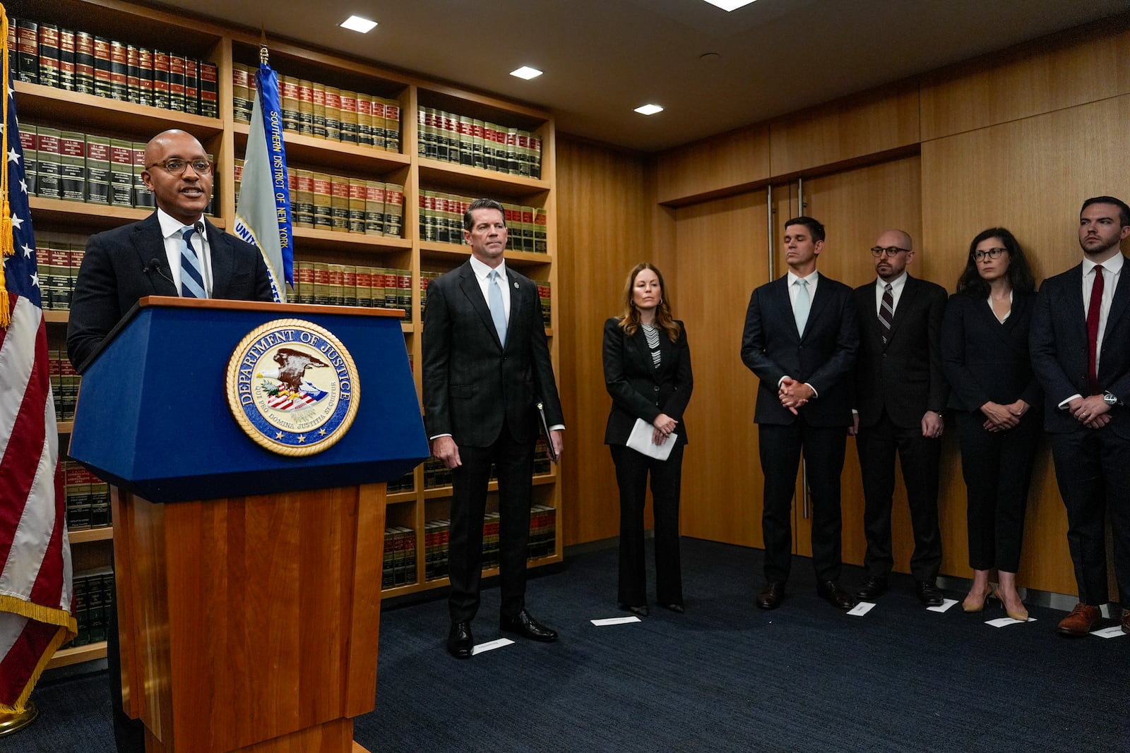 U.S. Attorney Damian Williams, left, speaks at a news conference detailing an indictment against New York City Mayor Eric Adams, Thursday, Sept. 26, 2024, in New York. (AP Photo/Julia Demaree Nikhinson)